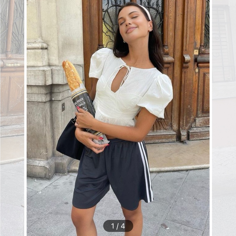 Keyhole neckline tie-front peplum top. White